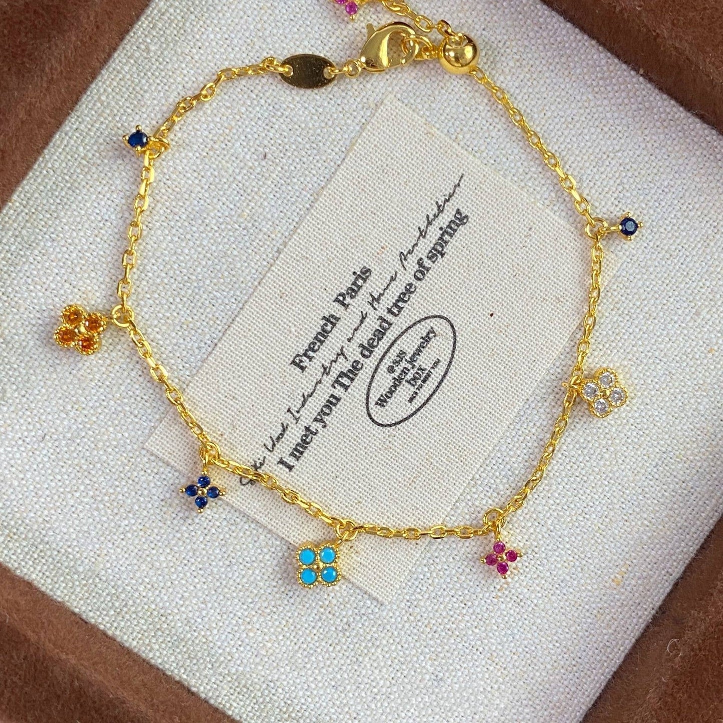 Last True Angel - Flower Charm Droplet Bracelet in Multi & Gold