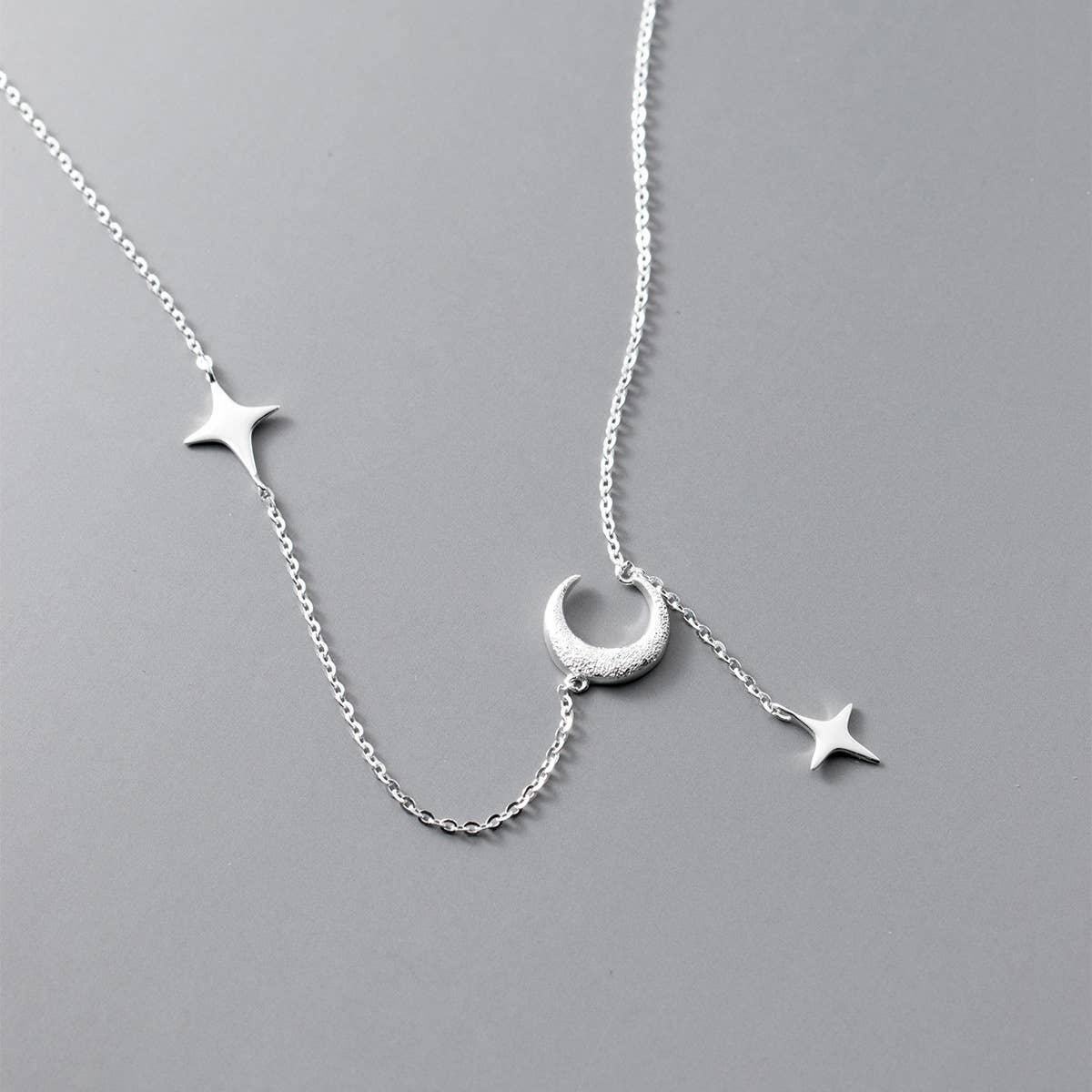 White Leaf - Star & Moon Drop Necklace in Sterling Silver