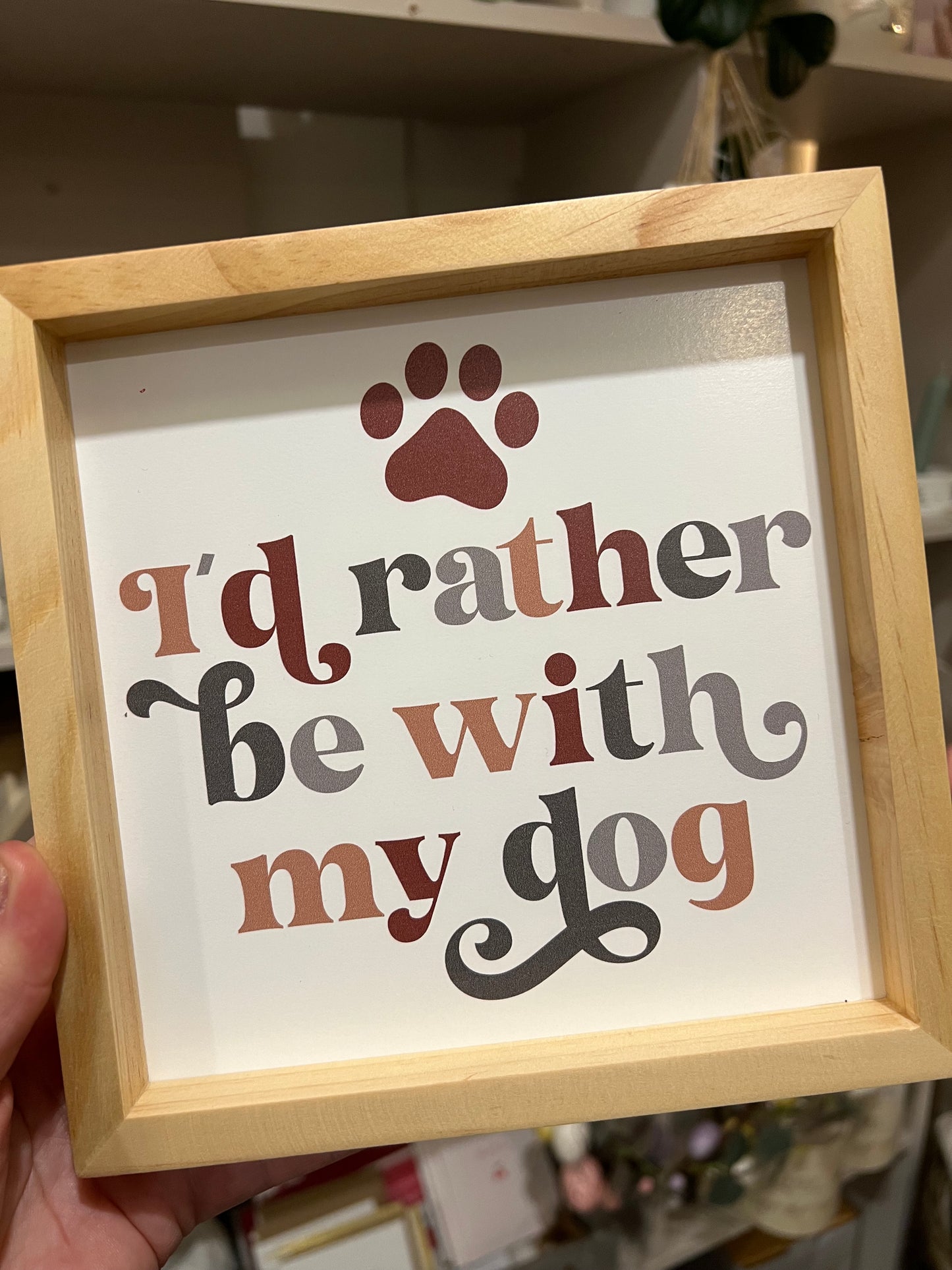 Colourful wooden dog sign