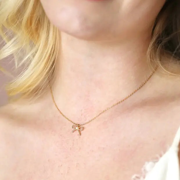 Tiny Pearl Bow Necklace in Gold