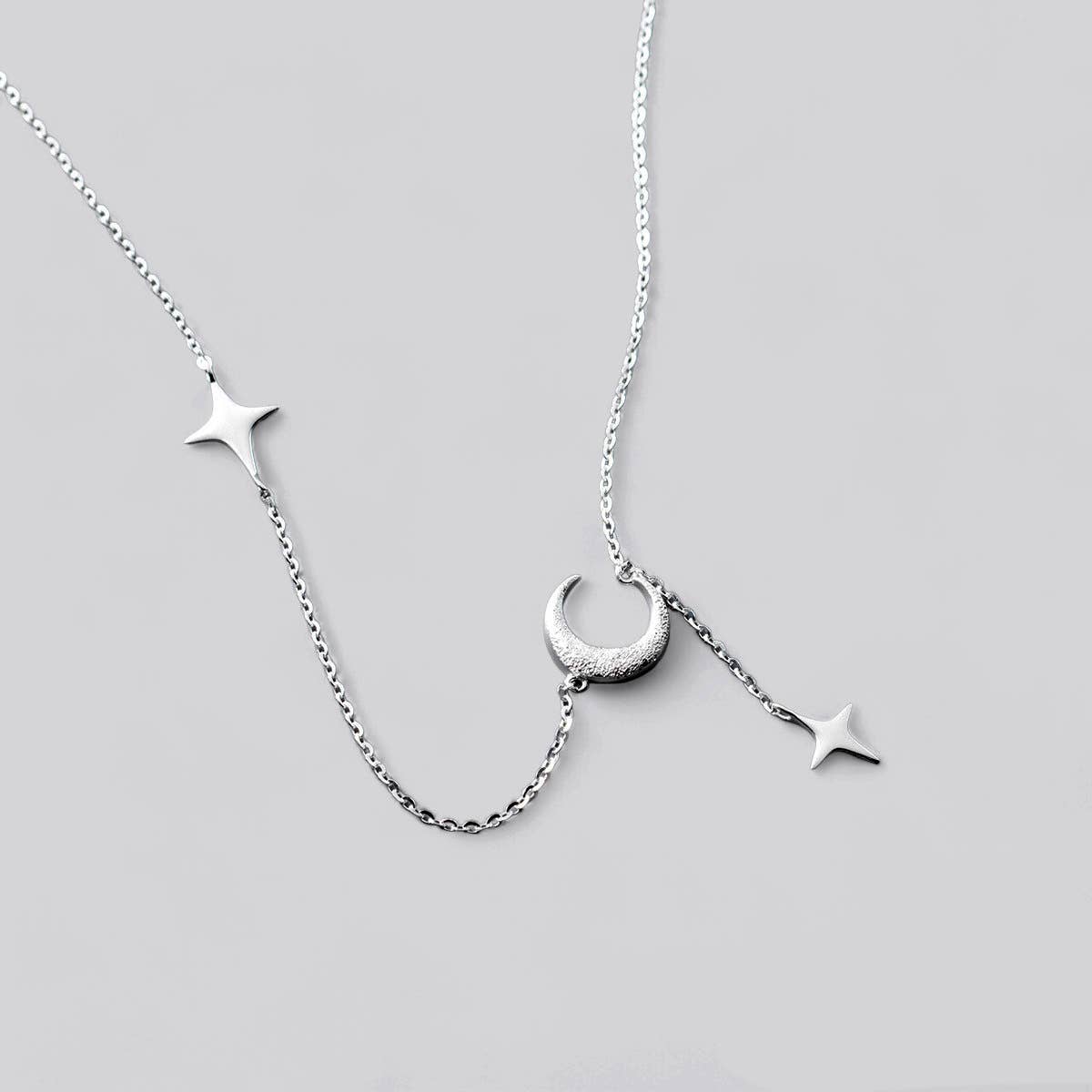 White Leaf - Star & Moon Drop Necklace in Sterling Silver