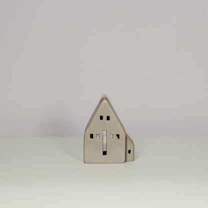 Glazed beige ceramic tea light house