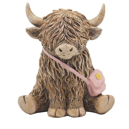 Highland cow with pink bag ornament