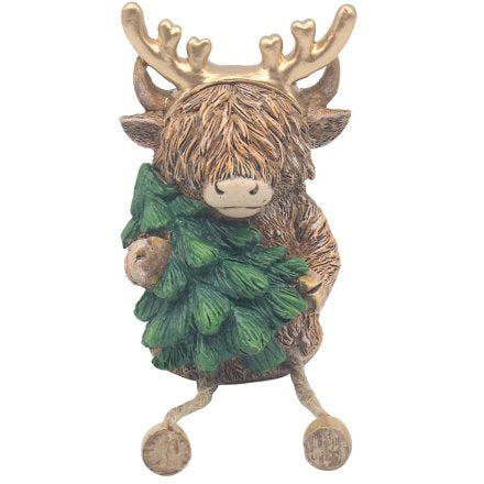 Christmas highland cow decoration holding tree